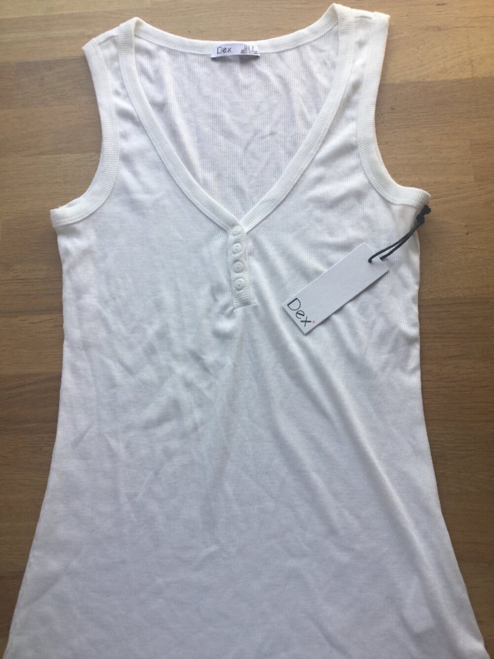 NWT Dex size small white  tank with a few buttons  measures 14 inches pit to pit